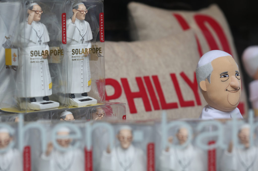 Pope Francis figurines are seen in a window display at a store along a street in Philadelphia Aug. 27. The pope will visit Philadelphia during his Sept. 22-27 visit to the United States. (CNS photo/Bob Roller)