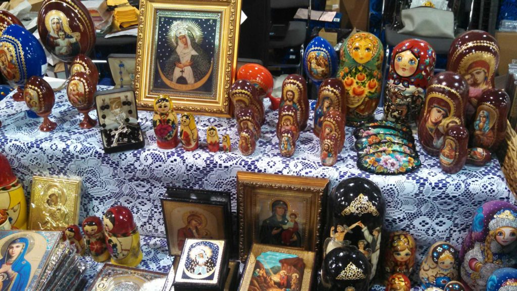 Colorful nesting dolls on display right next to the gorgeous icons of the Blessed Mother were for sale in a booth supporting the Catholic missions in Russia. (Joyce Coronel/CATHOLIC SUN)