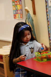 A preschooler plays in her renovated Queen of Peace classroom Sept. 19. (Ambria Hammel/CATHOLIC SUN)