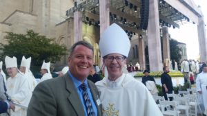 Paul Mulligan, president and CEO of Catholic Charities Arizona, poses with Bishop Thomas J. Olmsted outside the National Basilica of the Immaculate Conception following the canonization Mass. (Courtesy of Paul Mulligan).