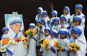Girls dressed up as Blessed Mother Teresa during an Aug. 26 event to commemorate her 104th birth anniversary in a school in Bhopal, India. Mother Teresa was born Agnes Gonxha Bojaxhiu Aug. 26, 1910, to Albanian parents in Skopje, in present-day Macedonia. She died in 1997 and was beatified by Pope John Paul II in 2003. (CNS photo/Sanjeev Gupta, EPA)