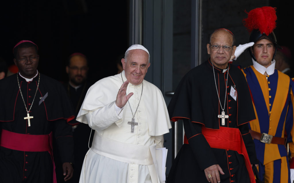Pope Francis walks next to Indian Cardinal Oswald Gracias as he leaves a 2014 morning session of the extraordinary Synod of Bishops on the family at the Vatican. (CNS photo/Paul Haring) 