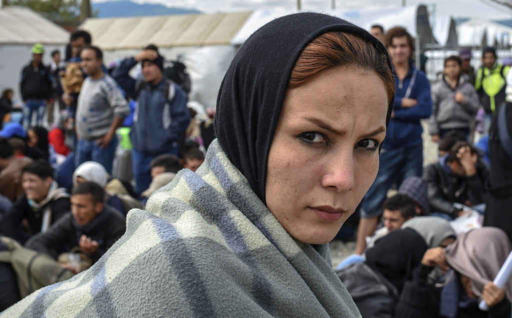 A migrant woman waits at the transit camp near Gevgelija, Macedonia, Sept. 29. (CNS photo/Georgi Licovski, EPA) 