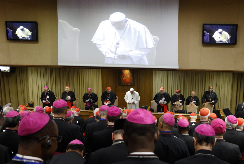 Pope Francis participates in prayer at the opening session of the Synod of Bishops on the family at the Vatican Oct. 5. (CNS photo/Paul Haring)