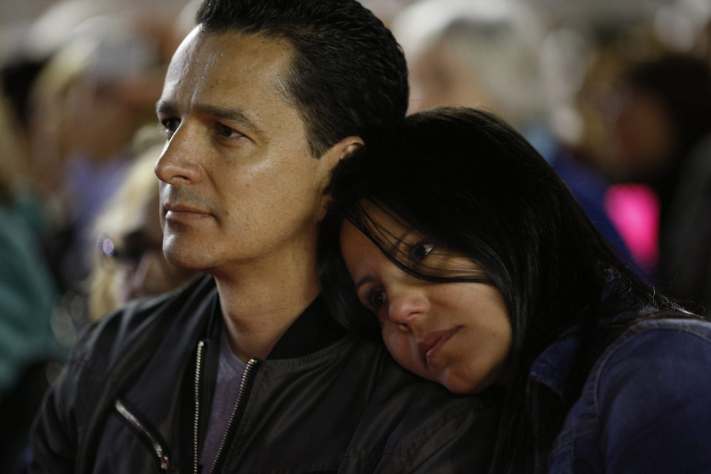 A couple attend a prayer vigil for the Synod of Bishops on the family in St. Peter's Square at the Vatican Oct. 3. Pope Francis attended part of the vigil. (CNS/Paul Haring) 