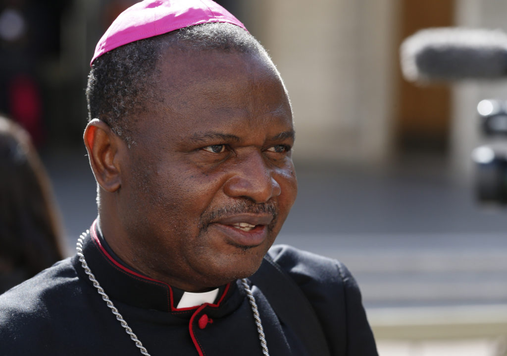 Bishop Jude Arogundade of Ondo, Nigeria, gives an interview to Catholic News Service as he leaves a session of the Synod of Bishops on the family at the Vatican Oct. 15. Bishop Arogundade said married couples need more help in dealing with infertility and childlessness. He said these are major causes of divorce in Africa. (CNS photo/Paul Haring) 