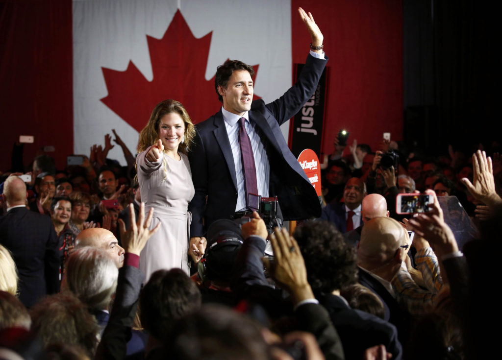 Liberal Party leader winner Justin Trudeau and his wife Sophie Gregoire wave during victory speech in Montreal, Oct. 19. Trudeau outpolled Prime Minister Stephen Harper, the incumbent, and Thomas Mulcair of the New Democratic Party. (CNS photo/Jim Young, Reuters)