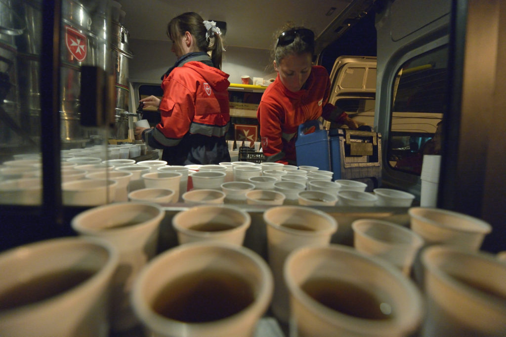 Hungarian volunteers prepare coffee Sept. 23, for refugees passing through Hegyeshalom, Hungary, on the way to Austria. (CNS photo/Paul Jeffrey) 