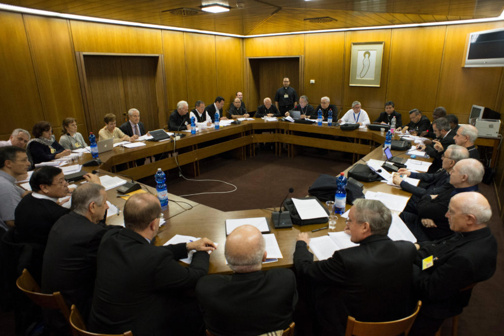 Spanish-speaking delegates at the Synod of Bishops on the family meet to discuss the working document at the Vatican Oct. 19. (CNS photo/L'Osservatore Romano) 