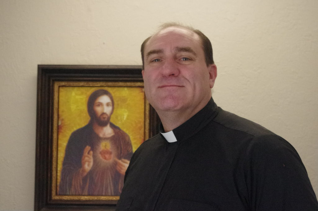 Fr. Darrin Merlino, CMF, pastor of Sacred Heart Parish in Prescott, has a passion for evangelization. He adopted the coat of arms of his order's founder: "The love of Christ impels us." (Joyce Coronel/CATHOLIC SUN)