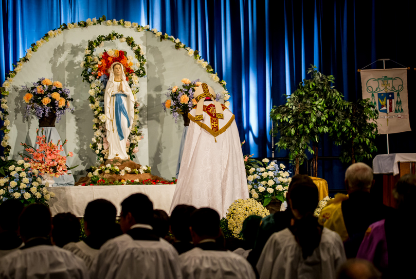 Bishop Thomas J. Olmsted bows in front of the Marian shrine erected for the 2014 Arizona Rosary Celebration. This year's day of prayer and inspiration for Catholics across the Diocese of Phoenix is Oct. 25. (Catholic Sun file photo)