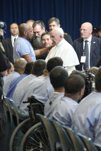 Pope Francis embraces an inmate during his visit to the prison. (Justin Bell/CATHOLIC SUN)