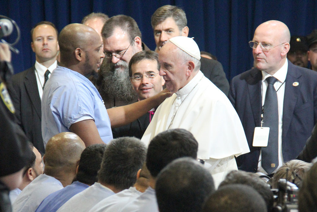 Pope Francis embraces an inmate during his visit to the prison. (Justin Bell/CATHOLIC SUN)