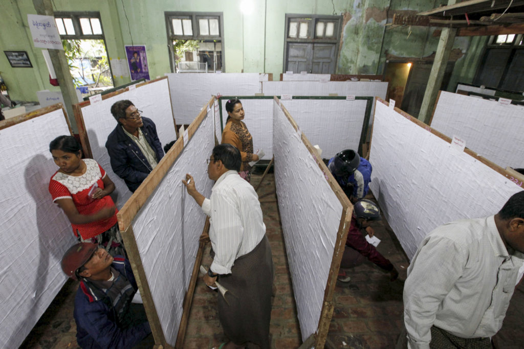People check their names on final voter list displayed at a polling station in Mandalay, Myanmar, Nov. 1. Myanmar will hold its nationwide general elections Nov. 8. (CNS photo/Hein Htet, EPA)