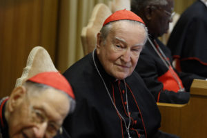 Italian Cardinal Andrea Cordero Lanza di Montezemolo, center, attends a conference on "Gaudium et Spes" at the Vatican Nov. 5. At left is Swiss Cardinal Georges Cottier and at right Nigerian Cardinal Francis Arinze. (CNS photo/Paul Haring) 