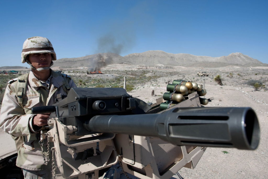 A Mexican soldier stands guard outside of Ciudad Juarez, Mexico, as soldiers burn tons of drugs in 2010. Pope Francis is exploring the possibility of visiting the previously problematic border city of Ciudad Juarez, where a battle between drug cartels during the last decade cost more than 10,000 lives in a four-year period. (CNS photo/Jesus Alcazar, EPA) 