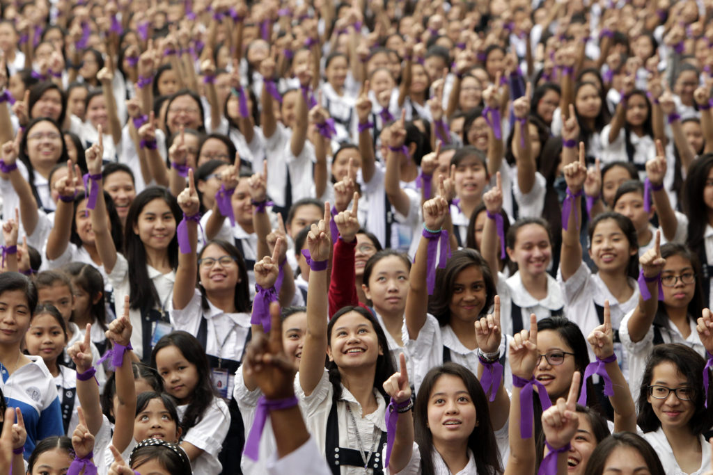 Philippine students inside an all-girl Catholic school in Manila, Philippines, demand an end to violence against women and girls Feb. 13. Cardinal Giuseppe Versaldi, head of the Congregation for Catholic Education, said Catholic schools need to boldly proclaim values. (CNS photo/Ritchie B. Tongo, EPA) 