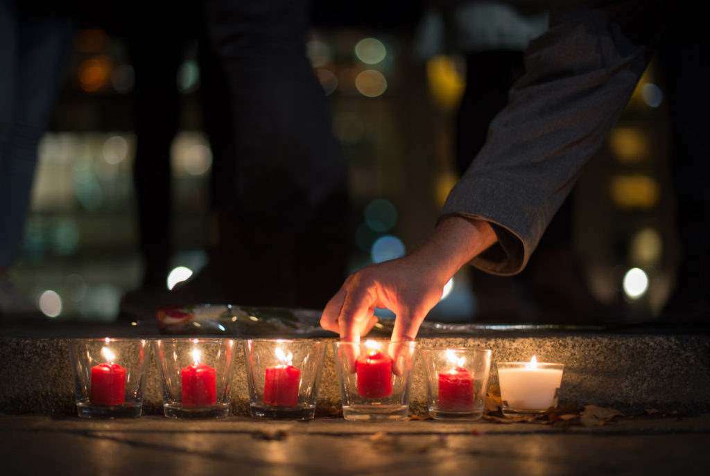 People light candles in tribute to the victims of the Paris attacks, outside the French Embassy in Berlin, Germany, Nov. 13. Dozens of people were killed in a series of attacks in Paris Nov. 13. (CNS photo/Lukas Schulze, EPA)