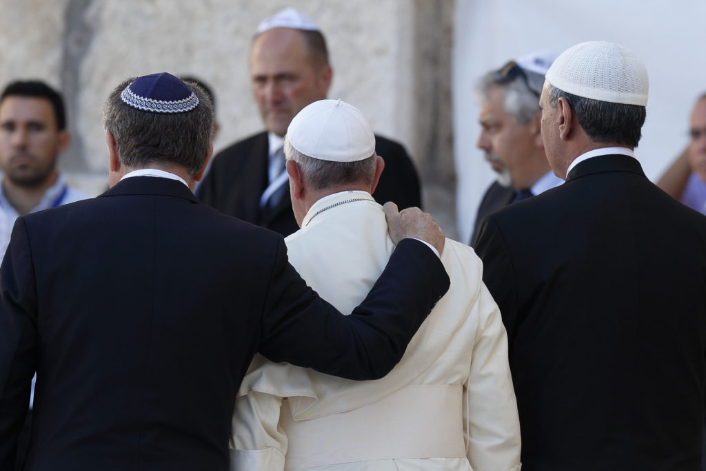 Pope Francis walks with Argentine Rabbi Abraham Skorka, left, and Omar Abboud, a Muslim leader from Argentina, as he leaves after praying at the Western Wall in Jerusalem in this May 26, 2014, file photo. In his official proclamation of the Holy Year of Mercy, Pope Francis called for "fervent dialogue" between Christians, Muslims and Jews. (CNS photo/Paul Haring) 