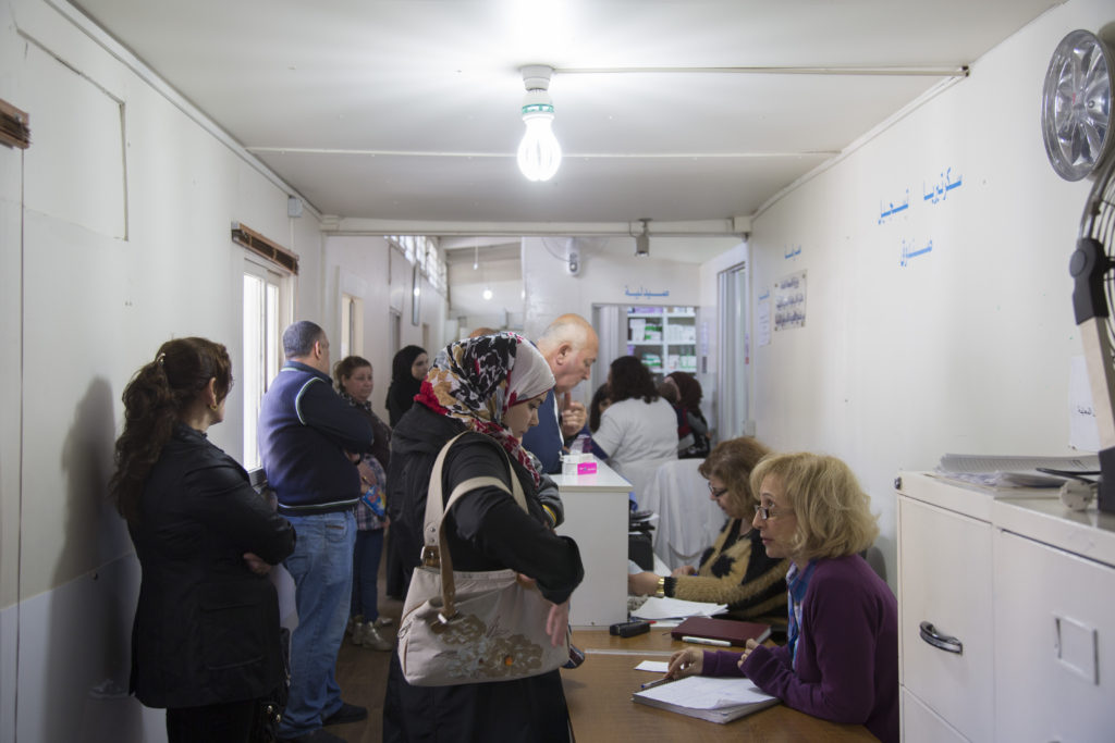 Patients arrive at Nov. 18 at St. Anthony's medical dispensary in Beirut. The clinic, run by the Good Shepherd Sisters, functions as a primary health care center, serving Iraqi and Syrian refugees, as well as Lebanon's poor. (CNS photo/Dalia Khamissy) 