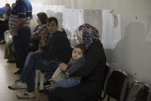 Patients wait for their turn to be treated at St. Anthony's medical dispensary in Beirut. The clinic, run by the Good Shepherd Sisters, functions as a primary health care center, serving Iraqi and Syrian refugees, as well as Lebanon's poor. (CNS photo/Dalia Khamissy) 