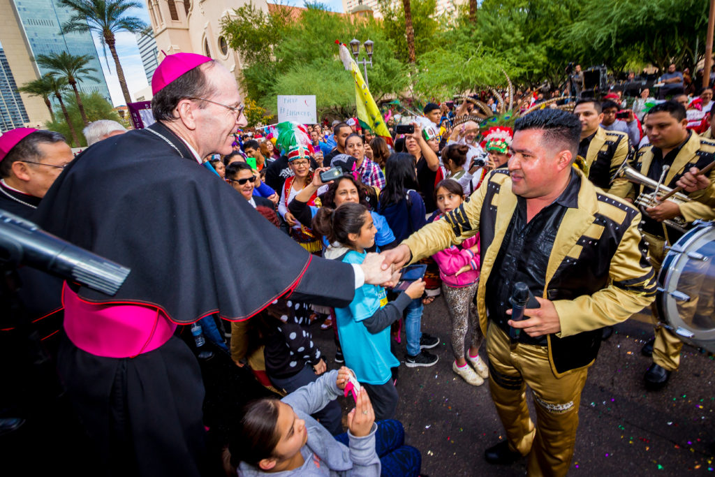 Bishop Thomas J. Olmsted greets mariachis at the "Honor Your Mother" event last year. (Billy Hardiman/CATHOLIC SUN file photo)