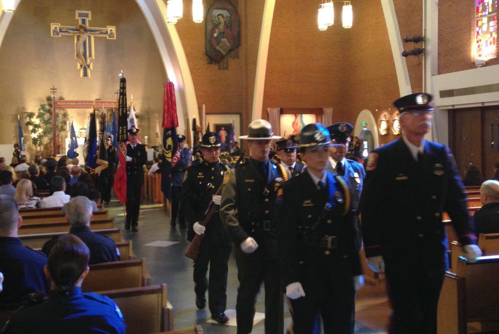 An honor guard made up of emergency personnel process out of Ss. Simon and Jude Cathedral during the annual Blue Mass Nov. 5. (Photo courtesy of Pam Lambros, Ss. Simon and Jude Cathedral)