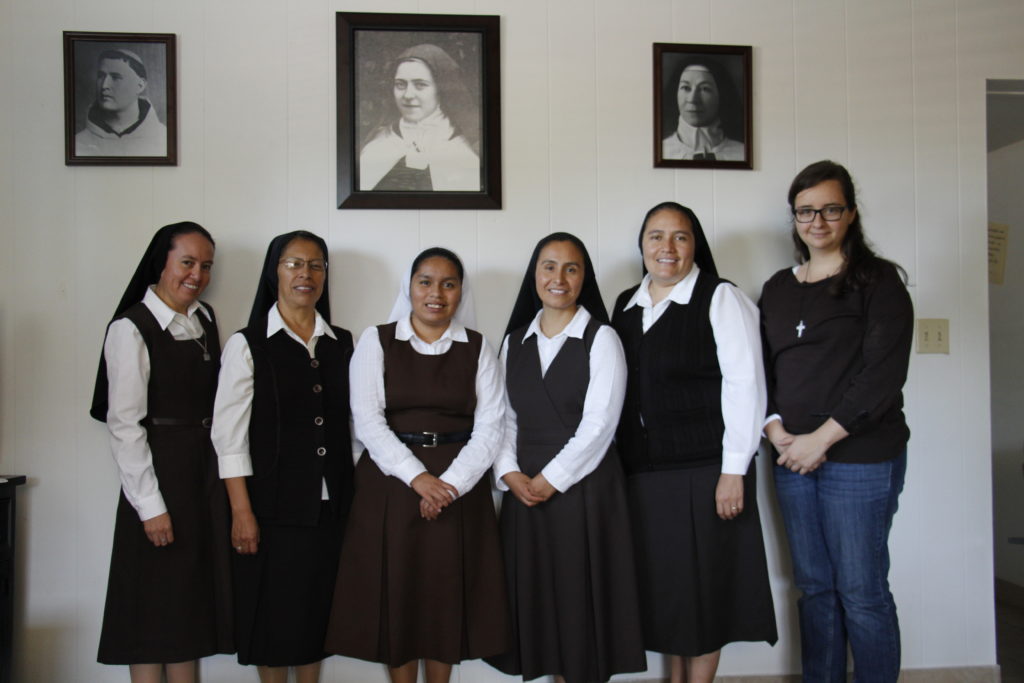 Carmelite Missionary Sisters of the Child of Jesus plus one woman in discernment pose in their convent near St. Daniel Parish Oct. 27. (Ambria Hammel/CATHOLIC SUN)