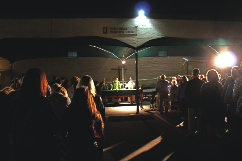 Several Holy Cross priests joined Bishop Thomas J. Olmsted for a special 30th anniversary Mass in the André House parking lot Oct. 30. (Ambria Hammel/CATHOLIC SUN)