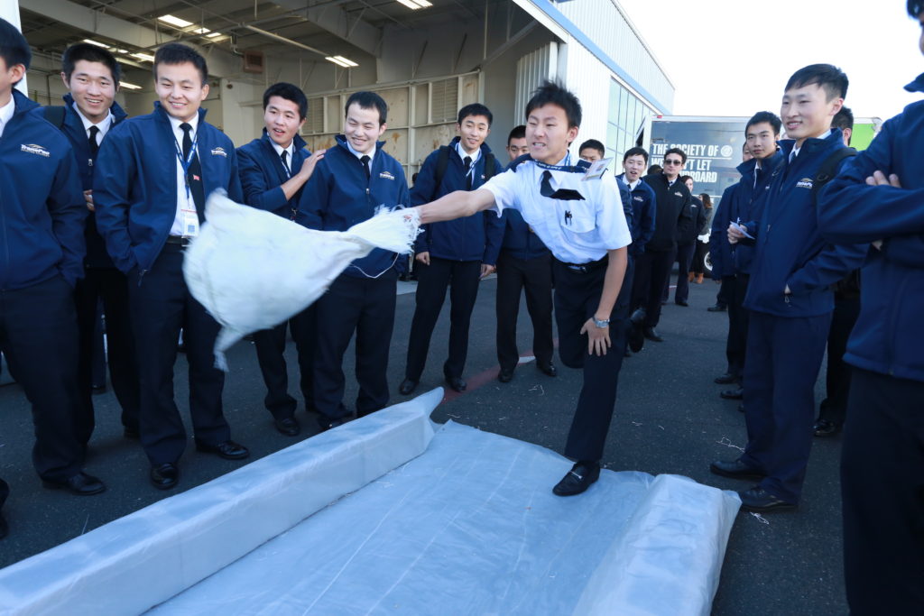 A TransPac aviation student prepares to send his turkey down a makeshift lane during the school's second Turkey Bowl Nov. 18. (courtesy photo)