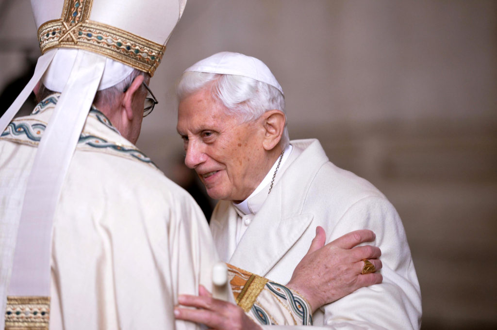 Pope Francis greets retired Pope Benedict XVI prior to the opening of the Holy Door of Saint Peter's Basilica at the Vatican Dec. 8. Pope Francis opened the Holy Door to inaugurate the Jubilee Year of Mercy. (CNS photo/Maurizio Brambatti, EPA)