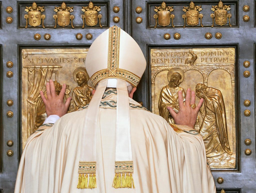 Pope Francis opens the Holy Door of St. Peter's Basilica to inaugurate the Jubilee Year of Mercy at the Vatican Dec. 8. (CNS photo/Maurizio Brambatti, EPA)