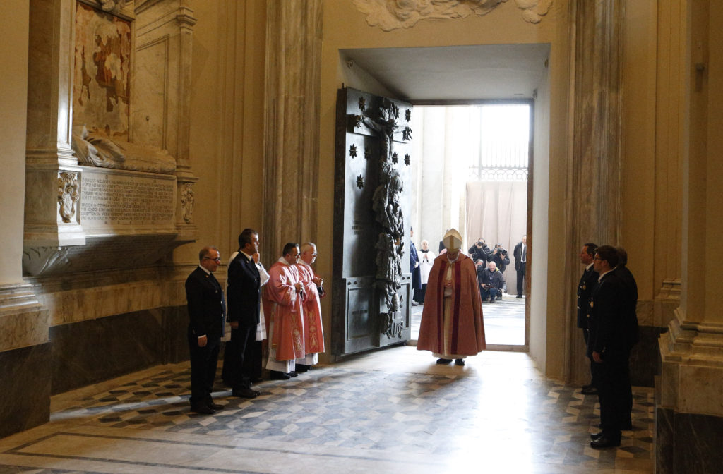 Pope Francis open the Holy Door of the Basilica of St. John Lateran in Rome Dec. 13. Holy doors around the world were opened at city cathedrals, major churches and sanctuaries Dec. 13 as part of the Jubilee of Mercy. (CNS photo/Paul Haring) 