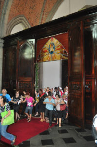 People walk through the Door of Mercy Dec. 13 at the Sao Paulo Cathedral for the Jubilee of Mercy. (CNS photo/Luciney Martins, courtesy O Sao Paulo) 