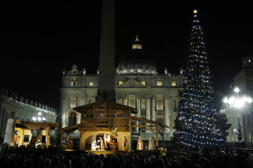 The Christmas tree and Nativity scene decorate St. Peter's Square during a lighting ceremony at the Vatican Dec. 18. (CNS photo/Paul Haring) 