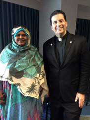 Anab Riyaleh, a graduate of the Hospitality and Tourism Training Institute, postes with Nagara University President Fr. James Maher, C.M. (courtesy photo)