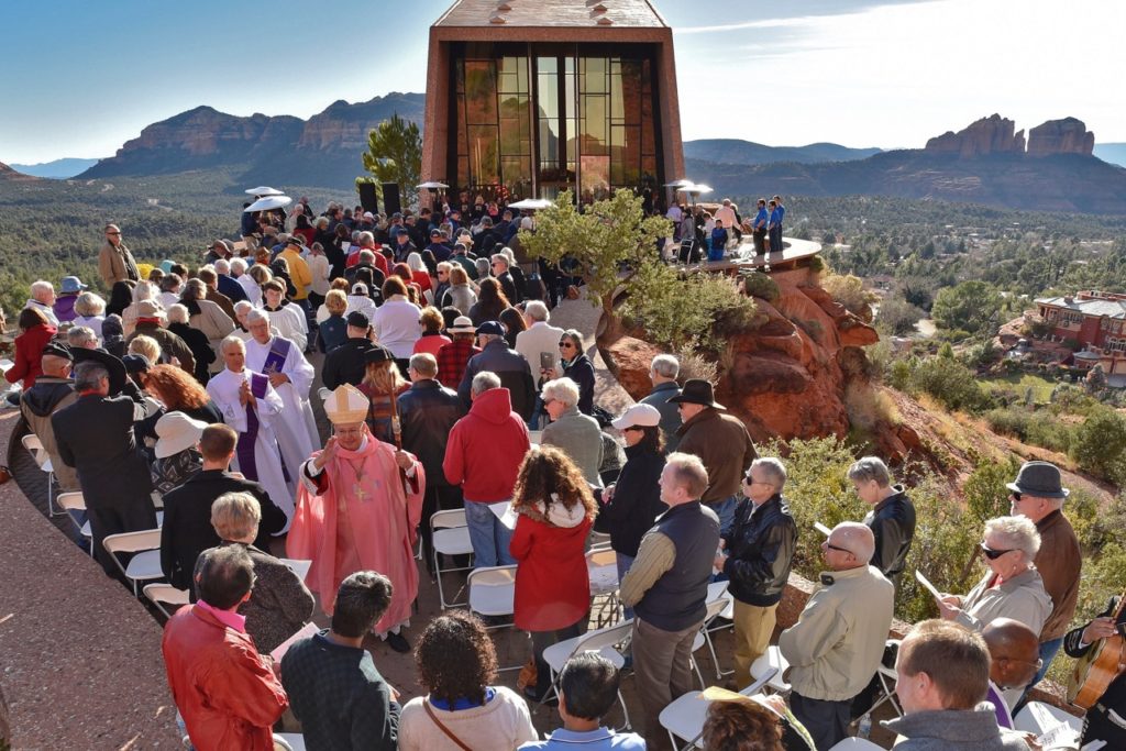 Auxiliary Bishop Eduardo A. Nevares blesses the faithful at the end of a Mass blessing and opening the doors to the Chapel of the Holy Cross in Sedona, one of two sets of doors in the Diocese of Phoenix designated as Holy Doors of Mercy for the Jubilee Year of Mercy. (Photo courtesy of Bob Simari)