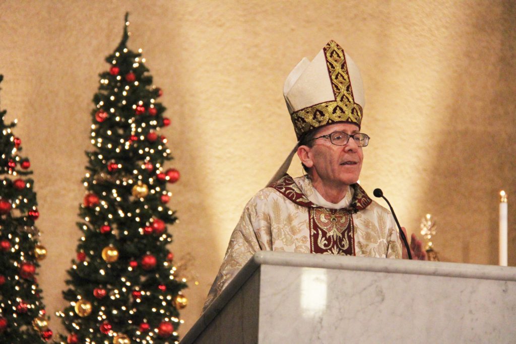 Bishop Thomas J. Olmsted addresses God’s glory and peace that come with Christ’s birth in his homily for the Christmas Eve Midnight Mass. (Justin Bell/CATHOLIC SUN)