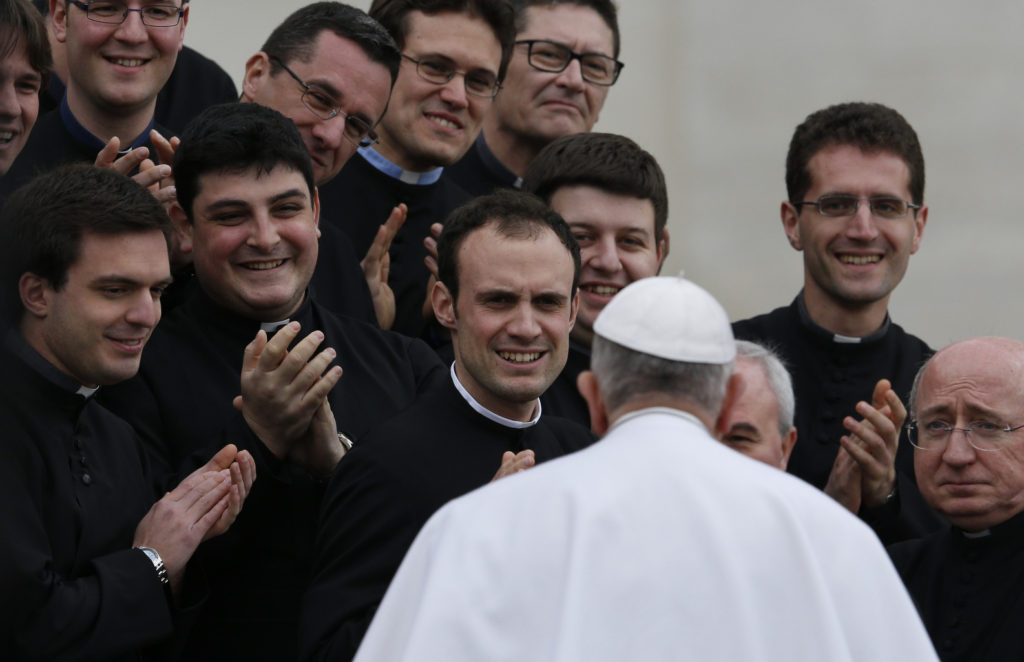 Pope Francis greets clergy during his general audience in St. Peter's Square at the Vatican March 4, 2015. (CNS photo/Paul Haring)