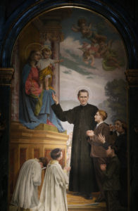 An mural showing St. John Bosco is seen in the Sanctuary of Our Lady of Help of Christians in Turin, Italy. (Paul Haring/CNS)
