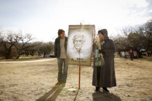 Carmen Dolny (left) and Rosie Garcia display a banner showing an image of Jesuit Father Eusebio Francisco Kino at the Tumacacori National Historical Park in Tumacacori, Ariz., Jan. 10. The women, both admirers of the pioneer missionary, took part in the park's Kino Legacy Day, paying homage to his contributions to the church and people in Pimeria Alta, what is now southern Arizona and northern Sonora, Mexico. (CNS photo/Nancy Wiechec) 