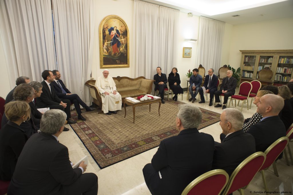 Pope Francis meets with people involved in the publishing of  "The Name of God Is Mercy" at the Domus Sanctae Marthae at the Vatican Jan. 11. The book features an interview the pope did with Italian journalist Andrea Tornielli. (CNS photo/L'Osservatore Romano, handout) 