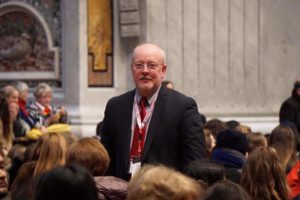 Kent Campbell stands around his three youth choirs inside St. Peter's Basilica in Rome Jan. 1. The group traveled from St. Bernard of Clairvaux in Scottsdale. (courtesy photo)
