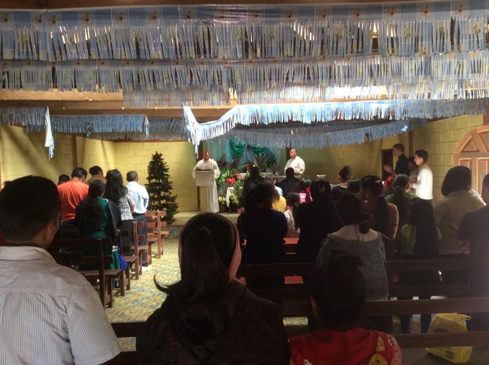 Vinhson Nguyen joins Central American Catholics for Mass during a mission trip. (courtesy photo)