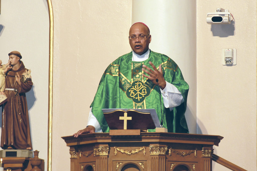 Washington Auxiliary Bishop Martin D. Holley gives the homily during the Diocese of Phoenix's Martin Luther King Mass celebrated at St. Mary's Basilica in Phoenix Jan. 18, national holiday named for the slain civil rights leader. Bishop Holley said Rev. King was a "man of the beatitudes" who provides an example to all. (CNS photo/Tony Gutierrez, Catholic Sun)