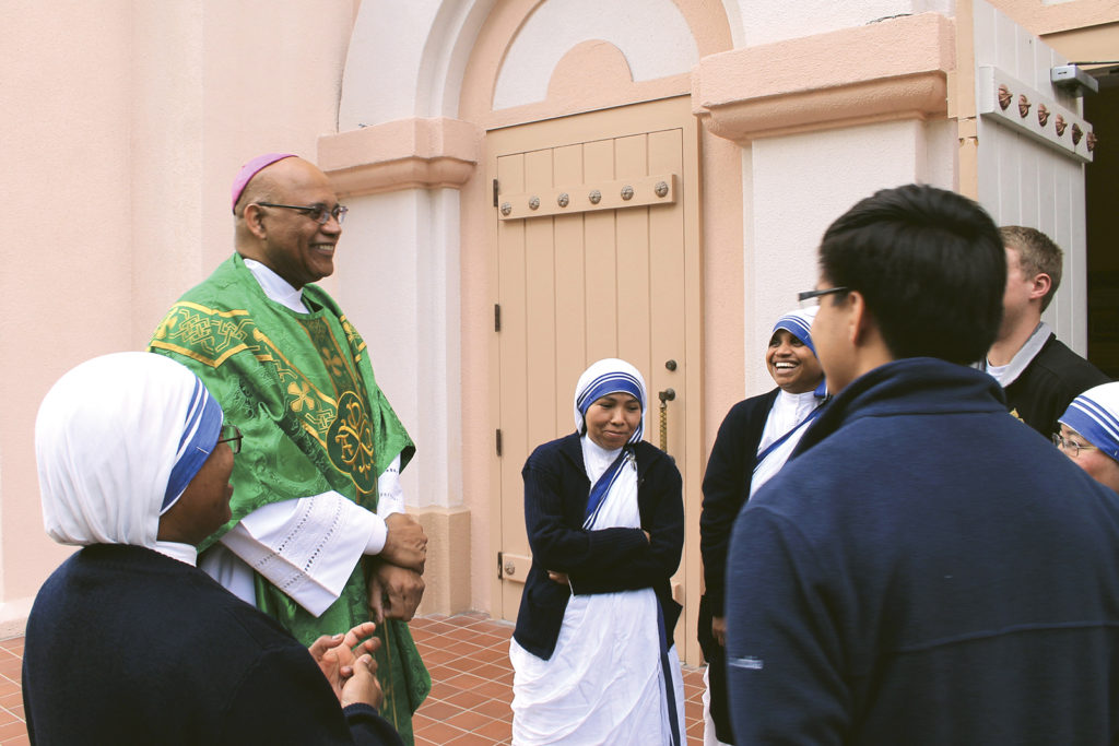 Outside St. Mary's Basilica in Phoenix Jan. 18, Washington Auxiliary Bishop Martin D. Holley greets members of the Missionaries of Charity who serve in the Diocese of Phoenix and two seminarians from the Archdiocese of the Military Services. Bishop Holley was the guest homilist for the diocese's Martin Luther King Mass, celebrated on the national holiday named for the slain civil rights leader. (CNS photo/Tony Gutierrez, Catholic Sun)