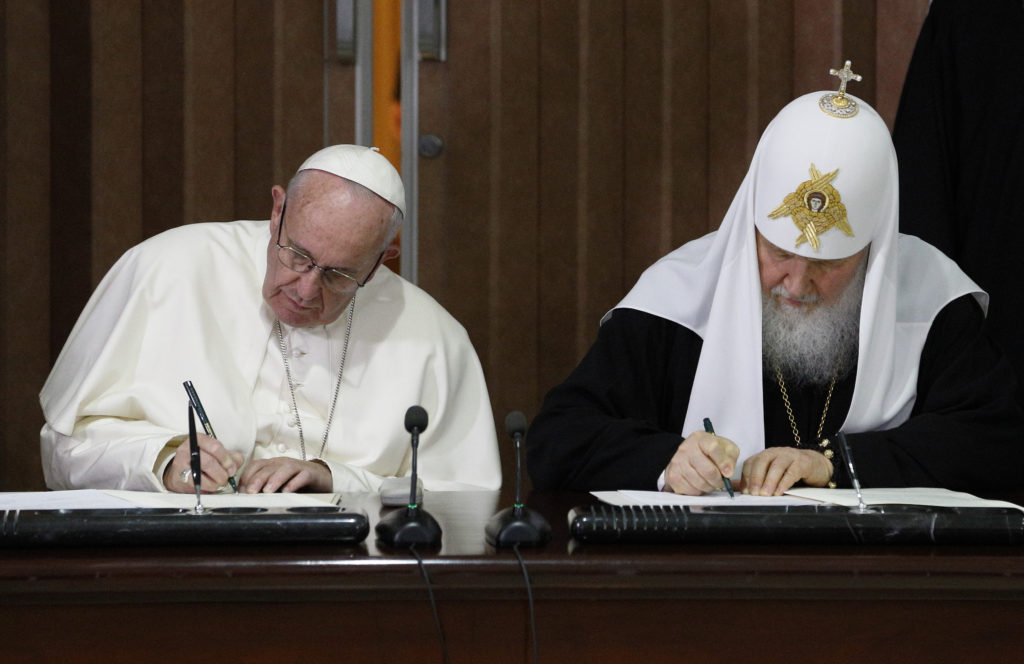 Pope Francis and Russian Orthodox Patriarch Kirill of Moscow sign a joint declaration during a meeting at Jose Marti International Airport in Havana Feb. 12. (CNS photo/Paul Haring) See POPE-PATRIARCH-CUBA Feb. 12, 2016.