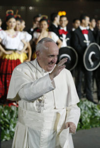 Pope Francis greets the crowd during a welcoming ceremony at Benito Juarez International Airport in Mexico City Feb. 12. (CNS photo/Paul Haring) See POPE-MEXICO-WELCOME Feb. 12, 2016.