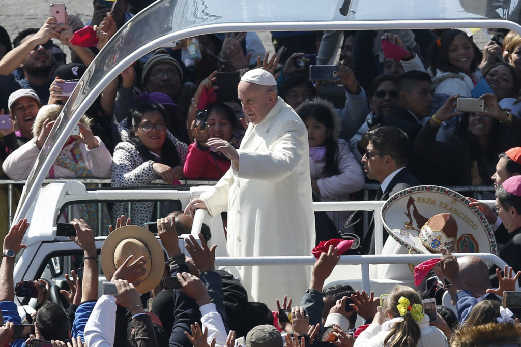 Pope Francis greets the crowd gathered in Mexico City's main square as Pope Francis arrives for a meeting with the nation's bishops in the cathedral Feb. 13. (CNS photo/Paul Haring)