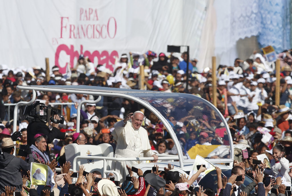 Pope Francis greets the crowd as he arrives to celebrate Mass with the indigenous community from Chiapas in San Cristobal de Las Casas, Mexico, Feb. 15. (CNS photo/Paul Haring)